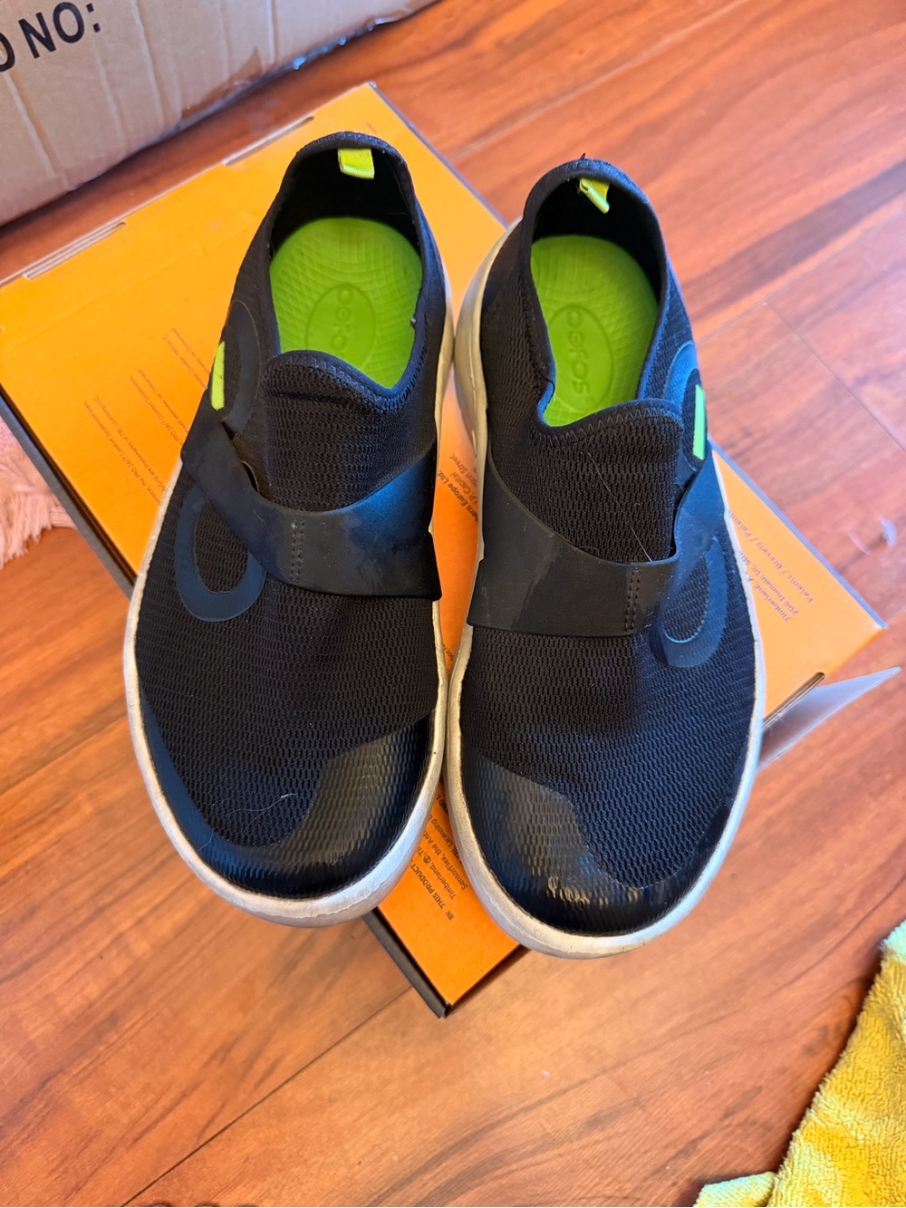 OOFOS Women's Black Athletic Slip-On Shoes with Lime Green Insoles